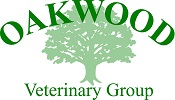 The Oakwood Veterinary Group logo. It features the silhouette of a tree in light green. Oakwood is written in large dark green font at the top of the tree, and Veterinary Group is written in a smaller dark green font underneath in.